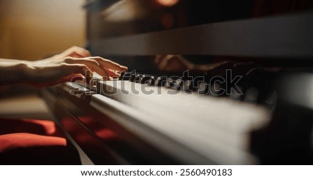 Close Up on Hands of a Talented Anonymous Pianist Making a Masterful Performance on a Grand Piano. Under Soft Stage Lights, Female Fingers Move Across the Keys, Creating Beautiful Classical Music
