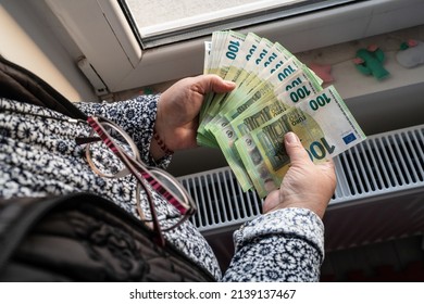 Close Up On Hands Of Unknown Caucasian Senior Woman Holding And Counting 100 Euro Banknotes Money Wealth Insurance Payment Or Lifetime Savings Copy Space