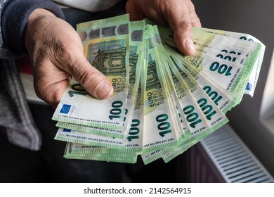 Close Up On Hands Of Unknown Caucasian Senior Man Holding And Counting 100 Euro Banknotes Money Wealth Insurance Payment Or Lifetime Savings Copy Space