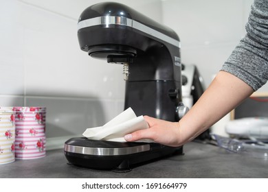 Close Up On Hands Of Unknown Female Caucasian Person Woman Wiping Cleaning Stand Mixer In The Kitchen At Home Disinfection