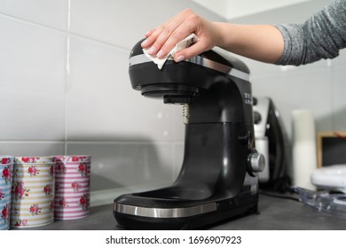 Close Up On Hands Of Unknown Female Caucasian Person Woman Wiping Cleaning Stand Mixer In The Kitchen At Home Disinfection