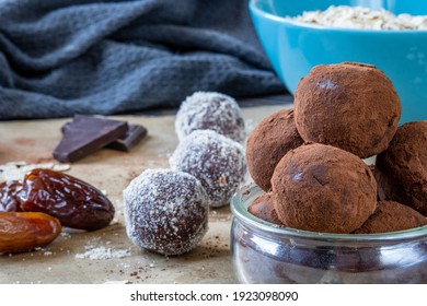 Close Up On Healthy Energy Protein Balls With Dates, Oats, Peanut Butter And Dark Chocolate. Homemade Gluten Free Truffle Bites Covered With Cocoa Powder. Vegan, Vegetarian Raw Appetizer Or Food Snack