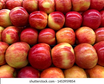 Close Up On Honey Crisp Red And Golden Apples In A Fruit Bin Display For Sale. Honeycrisp Is An Apple Cultivar Developed At The Minnesota Agricultural Experiment Station At The University Of Minnesota