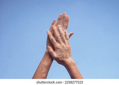 Close up on hygienic hand washing - Shutterstock ID 2258277523