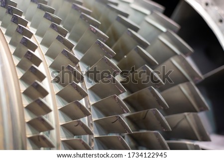 Close up on jet engine compressor blades.
