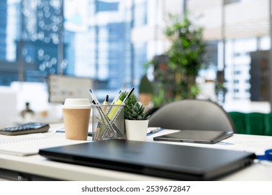 Close up on laptop in empty corporate accounting office used for budgeting, forecasting, and financial analysis purposes. Notebook device on desk in bright modern business workplace - Powered by Shutterstock