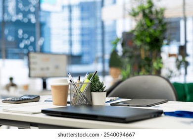 Close up on laptop in empty financial department office used for budgeting, forecasting, and financial analysis purposes. Notebook device on desk in bright modern company workspace - Powered by Shutterstock