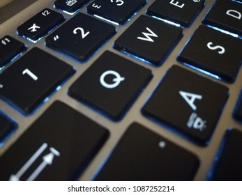 Close Up On A Laptop Keyboard With Blacklight On