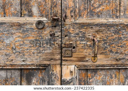 Close up on the lock and handle of an old door.