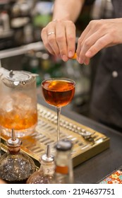 Close Up On A Mixologist Hands Preparing A Cocktail.