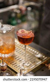 Close Up On A Mixologist Hands Preparing A Cocktail.