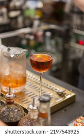 Close Up On A Mixologist Hands Preparing A Cocktail.