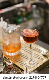 Close Up On A Mixologist Hands Preparing A Cocktail.