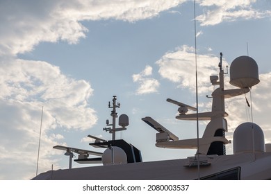 Close Up On Naval Transmission, Radio Communication Devices On A Boat, A Luxury Yacht, Including Antenna, Radio, As Well As Beacon And Radio Equipment. 

