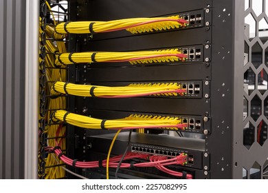 Close up on neat and tidy patched network cables, RJ45, connected to the switches and routers mounted on the rack in data centre, networking - Powered by Shutterstock