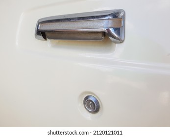 Close Up On An Old School Type Door Handle And Key Hole On A Truck With Smooth Paint Job