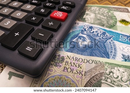 Close up on Polish Złoty banknote with calculator economic crisis concept new year price increase higher tax