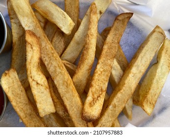 Close Up On Potato Chips (thick Cut French Fries) Fresh From A Deep Fryer