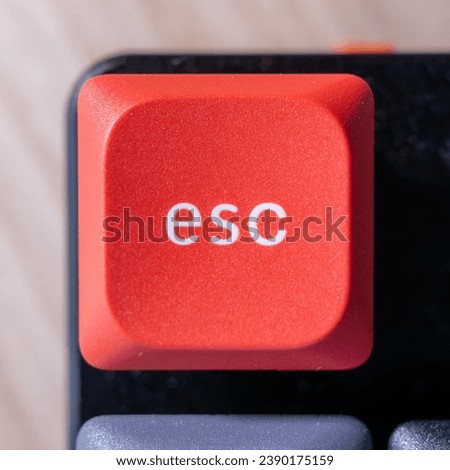 close up on a red esc key on a keyboard