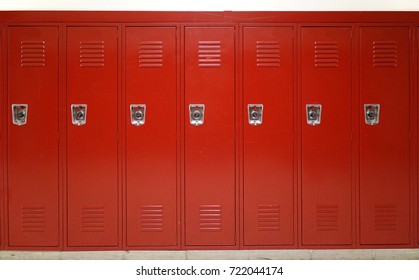 close up on red lockers in gym