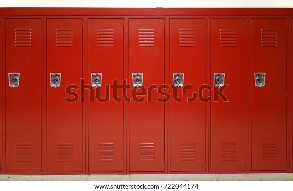 close up on red lockers in\
gym