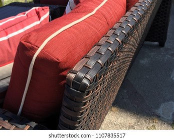 Close Up On Red Pillow And Wicker Outdoor Patio Furniture Wicker Pattern Texture With Red Cushions For A Fancy Backyard Setting On A Perfect Sunny Summer Day Relaxing At Home