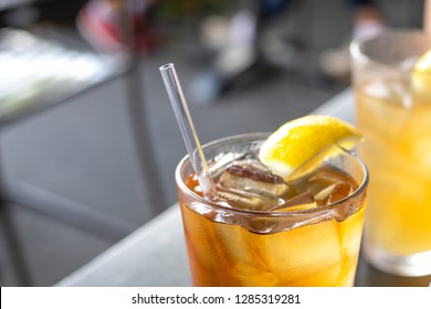 Close Up On A Reusable Acrylic Drinking Straw, In A Glass Of Ice Tea