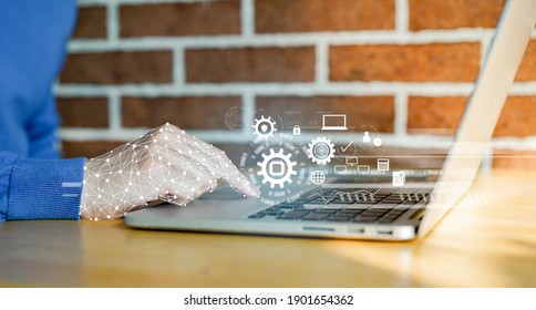 close up on robot (ai) hand working on laptop to checking correct data by use RPA function software program to help proof and detect and synchronize to system for future technology of business concept - Shutterstock ID 1901654362