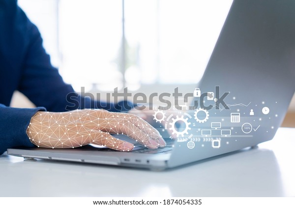 close up on robot (ai) hand working on laptop to\
checking correct data by use RPA function software program to help\
proof and detect and synchronize to system for future technology of\
business concept