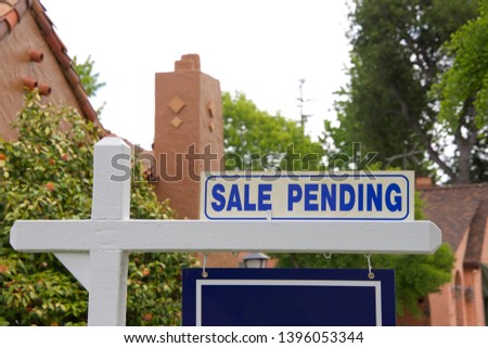 close up on Sale pending sign for home. First-time home buyers in California have a more difficult time affording property than do first-time buyers in other states.