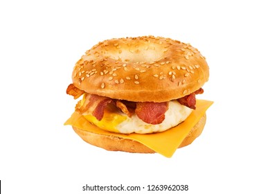 Close Up On A Sandwich Breakfast Isolated On White Background. Bagel, Egg, Cheese And Bacon.
