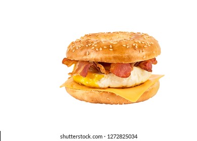 Close Up On A Sandwich Breakfast Isolated On White Background. Bagel, Egg, Cheese And Bacon.