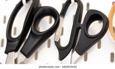 Close Up On Scissors Handle Hanging From Peg Board As A Storage Idea For Craft Room Or Workshop Wall