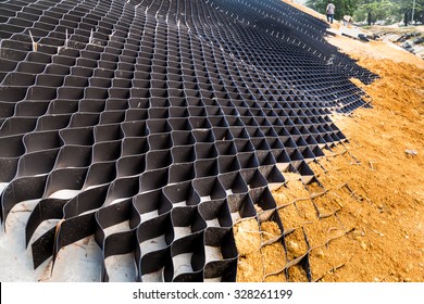 Close Up On Slope Erosion Control Grids On Steep Slope.