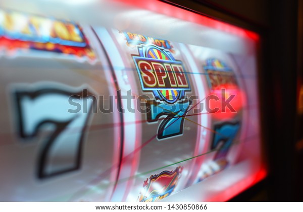 Close up\
on slot machine display. Slot machine\
drums.