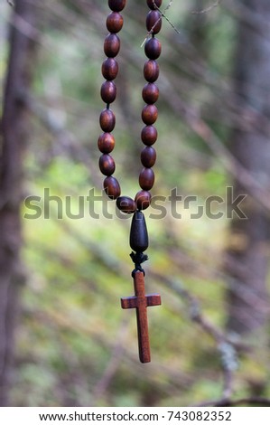 Close up on smile beauty handmade wooden cross in forest