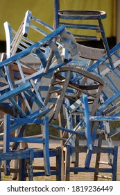 Close up on stack of old chairs
