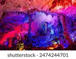 Close up on the stalactites in Reed Flute Cave in Guilin, China. Horizontal image with copy space for text