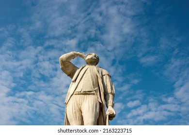Close up on statue of Galileo Galilei on Prato della Valle, square in city of Padua, Veneto, Italy, Europe. Blue sky background with a few small clouds.