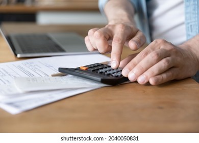 Close Up On Table Lie Document, Invoices, Receipts, Utility Bills, Unrecognizable Caucasian Male Hands Costs Personal Incomes And Expenses Using Calculator, Pay For Loan, Manage Family Budget Concept