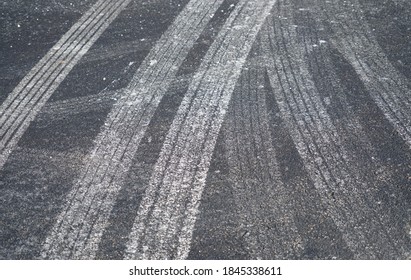 Close Up On Tire Tracks With Snow Melt Salt On The Street               