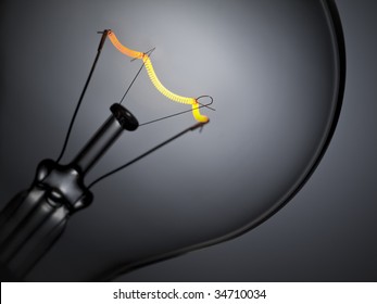 Close up on a turned on light bulb over a grey background. - Powered by Shutterstock