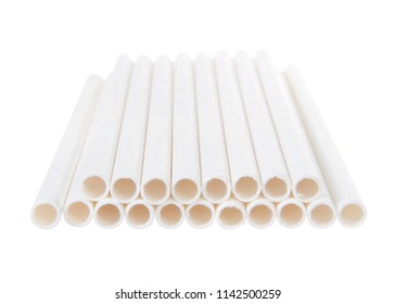Close up on white paper straws laying flat isolated on white background.  ecologically friendly yet durable paper drinking straws.