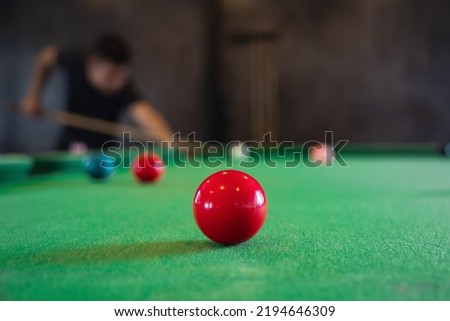Close up on white and red snooker ball or pool on the snooker table. Snooker player competition snook game, bet. Indoor snooker sport.