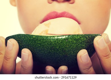 Close Up On A Woman Eating Avocado