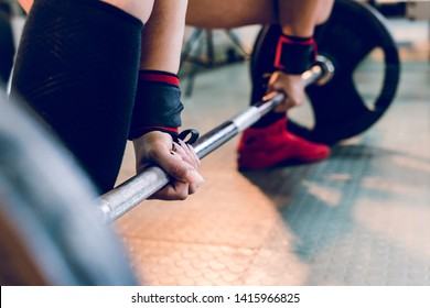 Close Up On Woman Female Athlete Holding Grip On The Barbell At The Gym Ready For Dead Lift Training Work Out Bodybuilding Strong Power Lifting