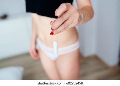 Close Up On Woman Holding White Cotton Tampon In Hand. Woman Period