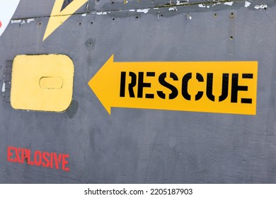 Close Up On A Yellow Rescue Arrow On An Old Jet Plane