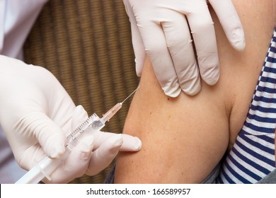 Close up of one giving an injection