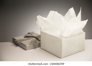 Close Up Of Opened Gift With Tissue Paper